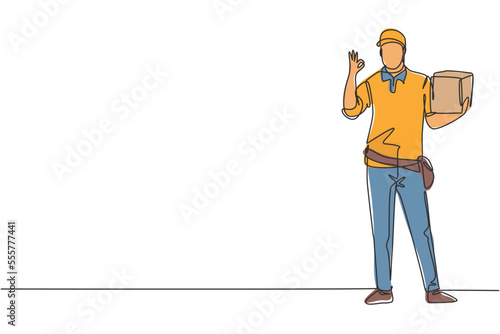 Continuous one line drawing deliveryman stands with gesture okay carrying package box that customer order to be delivered safely. Success business. Single line draw design vector graphic illustration
