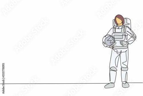 Single continuous line drawing of young female astronaut holding helmet with hands on hip. Professional work job occupation. Minimalism concept one line draw graphic design vector illustration