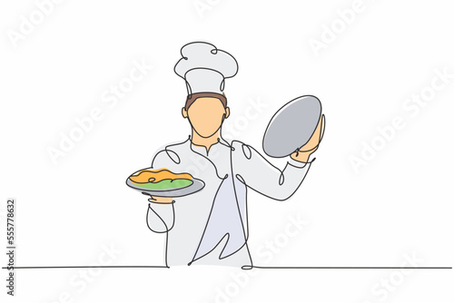 One continuous line drawing of young handsome male chef opening cloche tray to serve main dish to customer at hotel restaurant. Excellent service concept single line draw design vector illustration