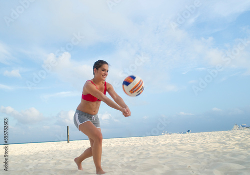 Woman Playing Beach Volleyball, Reef Playacar Resort and Spa, Playa del Carmen, Mexico photo