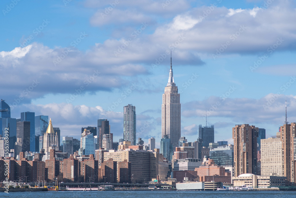 Obraz premium NYC Manhattan skyline buildings in a perfect daylight with clouds in the sky