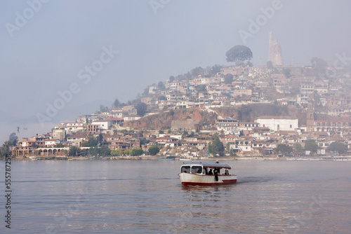 Boat on Lake Patzcuaro with Janitzio Island in Background, Patzcuaro, Michoacan, Mexico photo