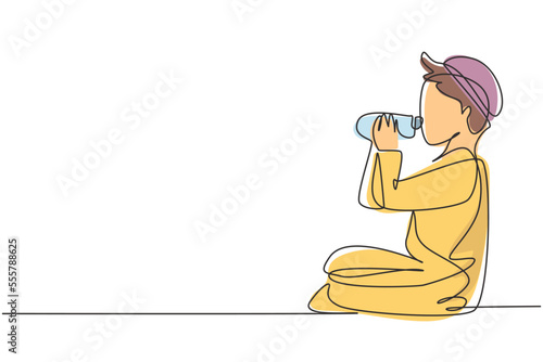 Single one line drawing Arabian boy sitting while enjoying a bottle of fresh milk to fulfill his body nutrition. Child health and growth. Modern continuous line draw design graphic vector illustration