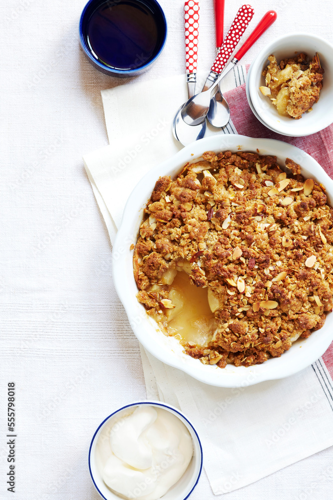 Overhead View of Apple Crumble Dessert with Whipped Cream, Studio Shot Overhead View of Apple Crumble Dessert with Whipped Cream, Studio Shot
