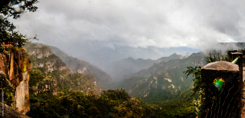 Fototapeta premium canyon in rainy day with foggy sky and mountains in the background, copper canyon in chihuahua 
