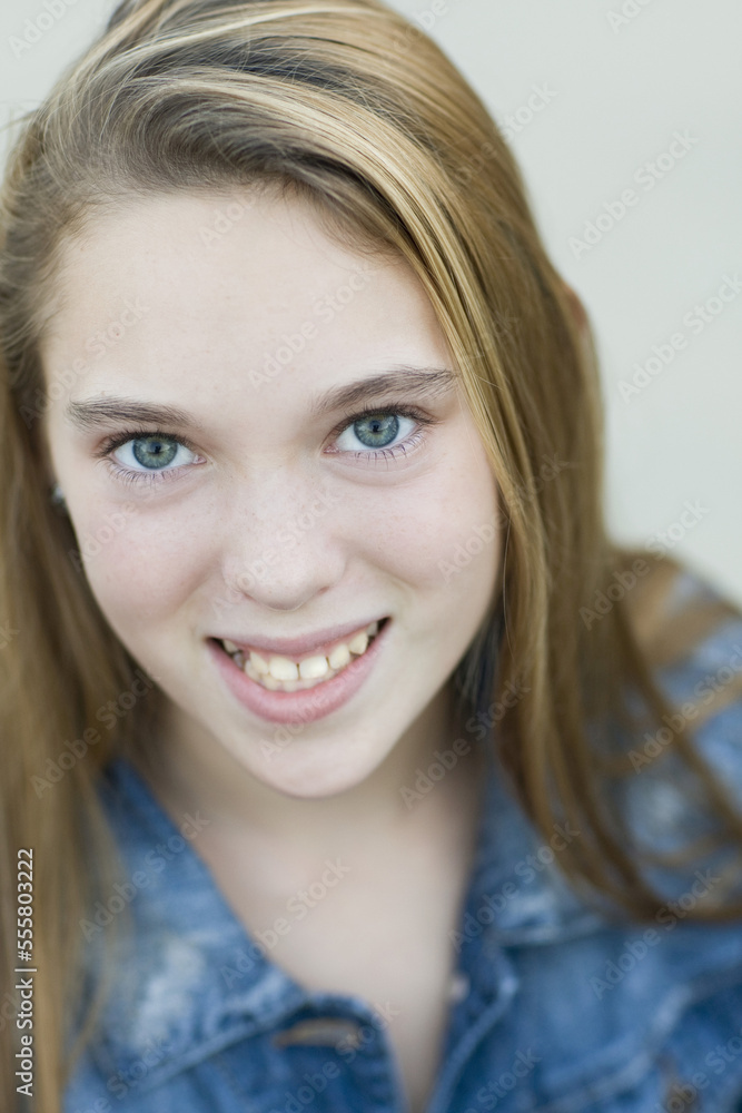 Close-up Portrait of pre-teen girl smiling and looking at camera Close-up Portrait of pre-teen girl smiling and looking at camera