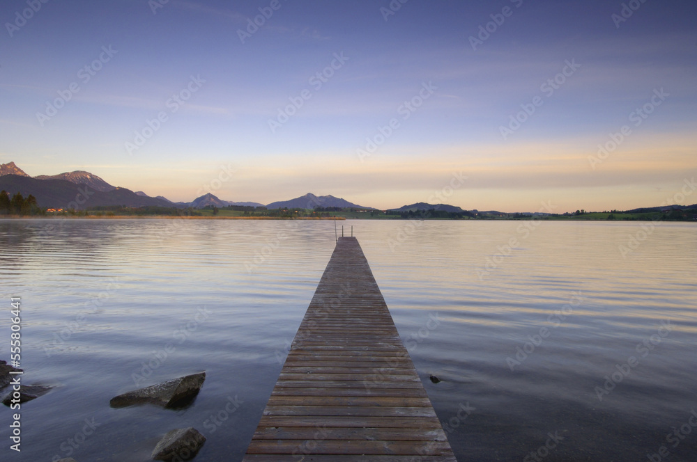 Pier on Lake at Sunrise, Lake Hopfensee, Bavaria, Germany Pier on Lake at Sunrise, Lake Hopfensee, Bavaria, Germany