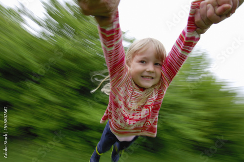 Girl Spinning in Circle photo