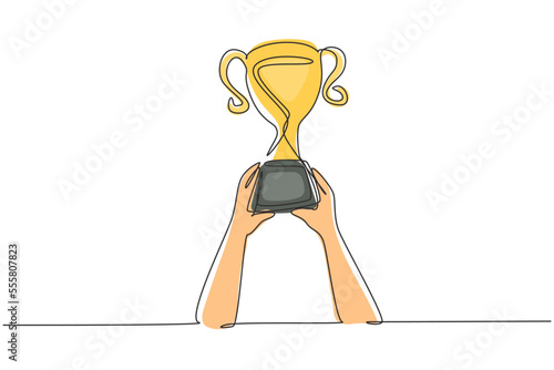 Continuous one line drawing trophy is held by both hands. Symbol of winning championships, matches and sports competitions. Best achievement ever. Single line draw design vector graphic illustration
