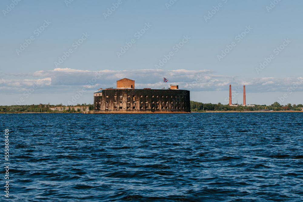View from a boat on Fort Alexander the First in Kronstadt in the waters of the Gulf of Finland. Island of forts. Summer day