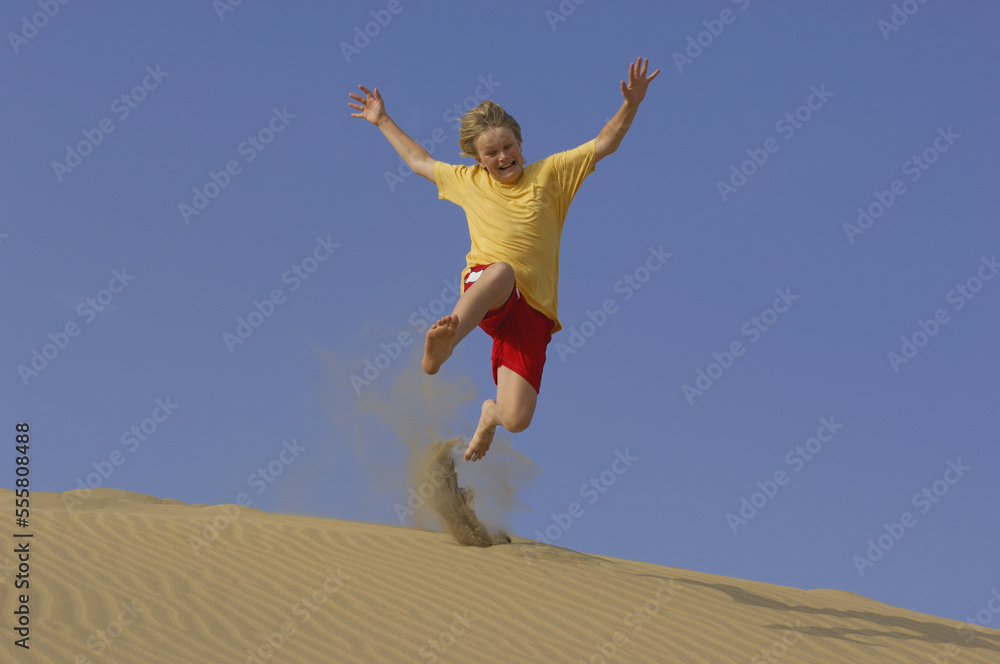 Boy Playing in Sand Dunes, Playa del Ingles, Cran Canaria, Canary Islands Boy Playing in Sand Dunes, Playa del Ingles, Cran Canaria, Canary Islands
