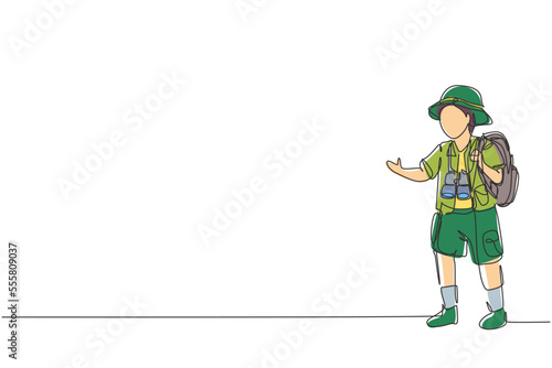 Single one line drawing 
boy wearing safari outfit complete with hat carrying bag and draping binoculars. Little adventurer learns about nature. Continuous line draw design graphic vector illustration