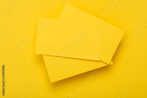 Yelow Blank business cards for corporate identity on yellow background. Creative mockup.