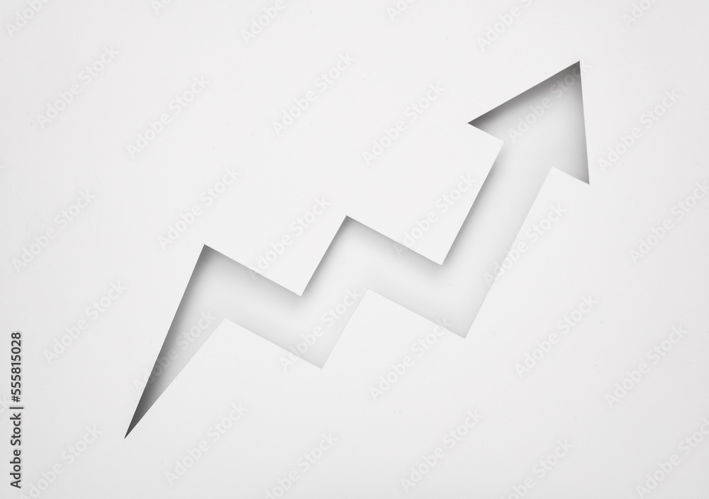Cut paper in the shape of a growth arrow Cut paper in the shape of a growth arrow