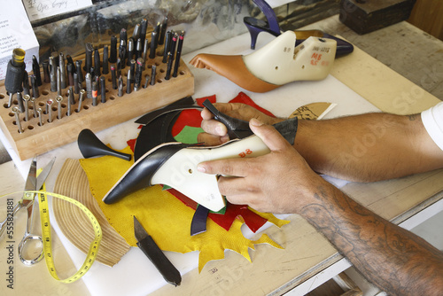 Close-up of Man Making a Shoe, Maida's Black Jack Boot Company, Houston, Texas, USA photo