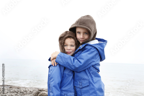 Portrait of Boys Hugging, Jamaica Beach, Galveston Island, Texas, USA