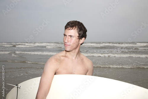 Man Holding Surfboard, Galveston, Galveston Island, Galveston County, Texas, USA photo