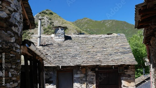 The mountains above the Spanish village of Penalba de Santiago the tilt down to reveal some of the ancient homes in the historic town photo