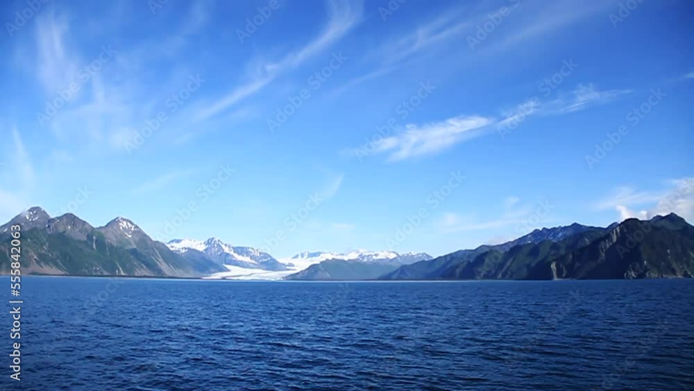 Waves Ripple in Lake with Mountains and Glacier in Background in Alaska Waves Ripple in Lake with Mountains and Glacier in Background in Alaska