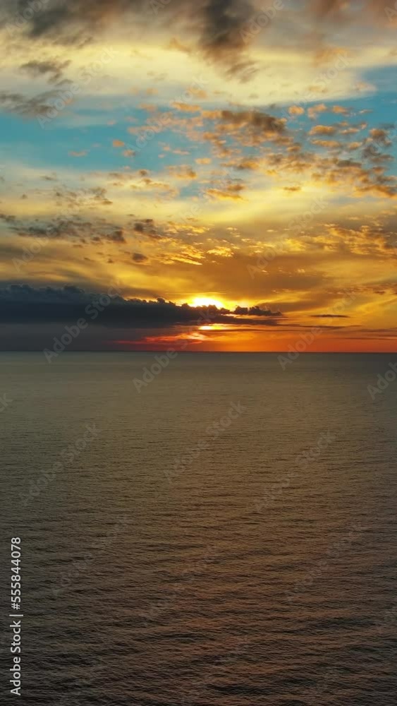 Aerial view of sea surface during a beautiful colourful sunset, timelapse. Vertical video Aerial view of sea surface during a beautiful colourful sunset, timelapse. Vertical video