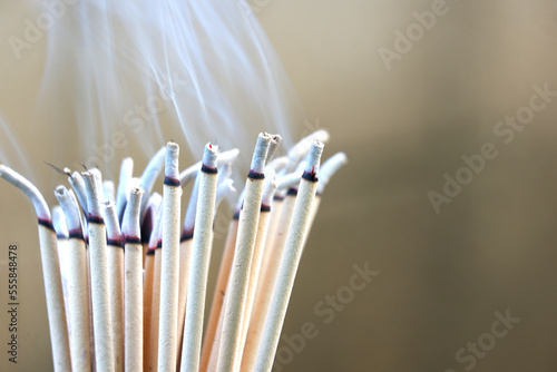 Close-up of burning incense sticks  with beautiful smoke.