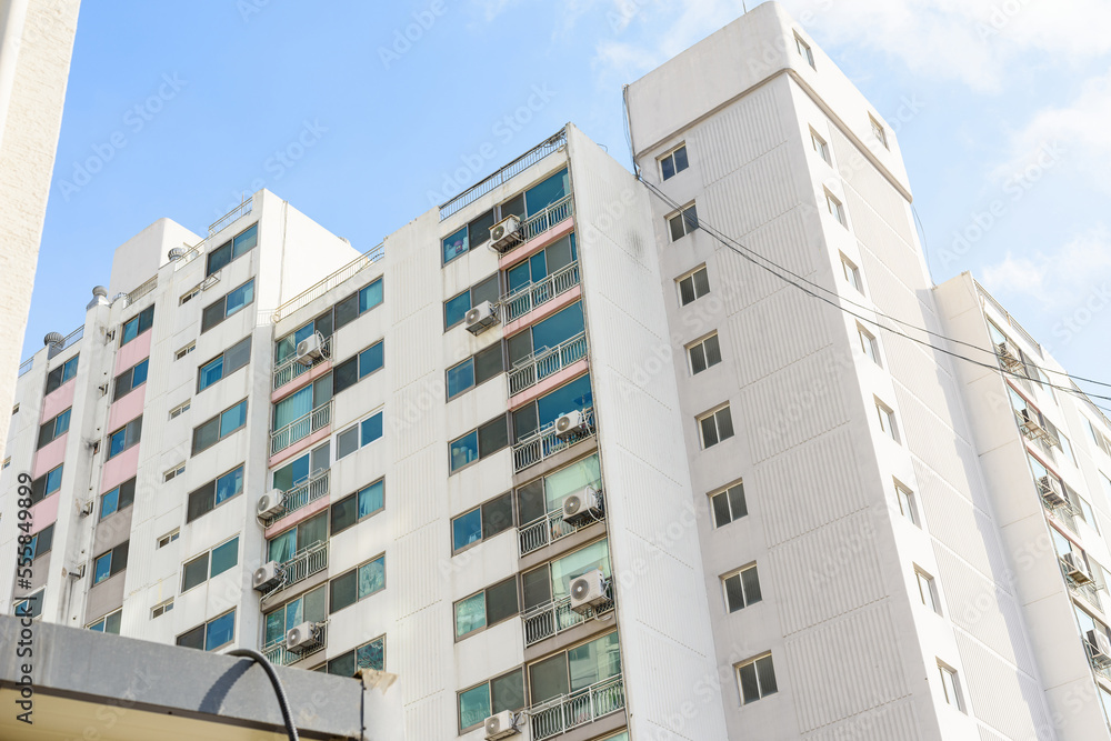 A tall apartment that is generally inhabited by Koreans