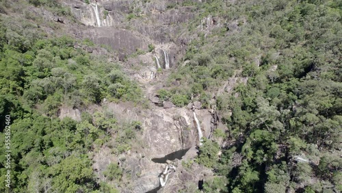 Jourama Falls And Series Of Cascades At Paluma Range National Park Fringed By Rainforest In Summer In Yuruga, QLD, Australia. - aerial photo