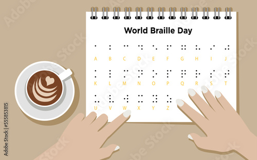 World Braille Day, hands reading braille alphabet with coffee on the desk