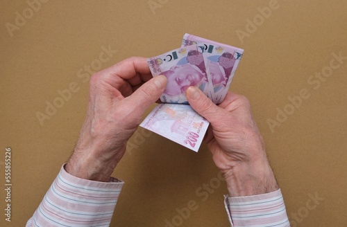 The old hand holding money. Pension. News of pension hikes.  photo