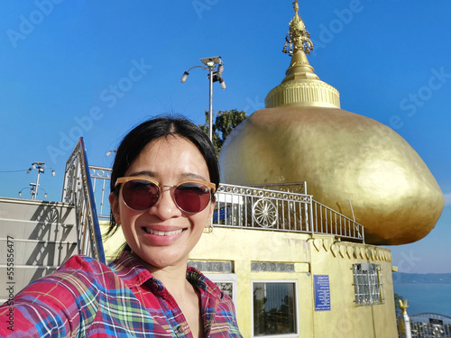 Selfie woman Wat Koh Sireh temple, Phuket, Thailand. photo