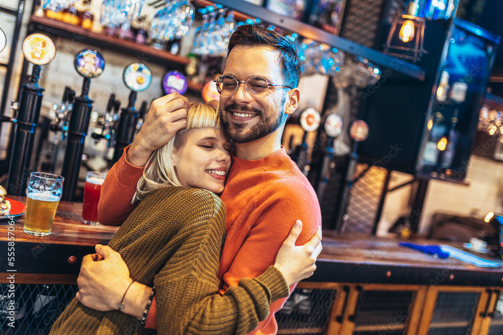 Portrait of a beautiful couple while having romantic moments in cafe. Portrait of a beautiful couple while having romantic moments in cafe.
