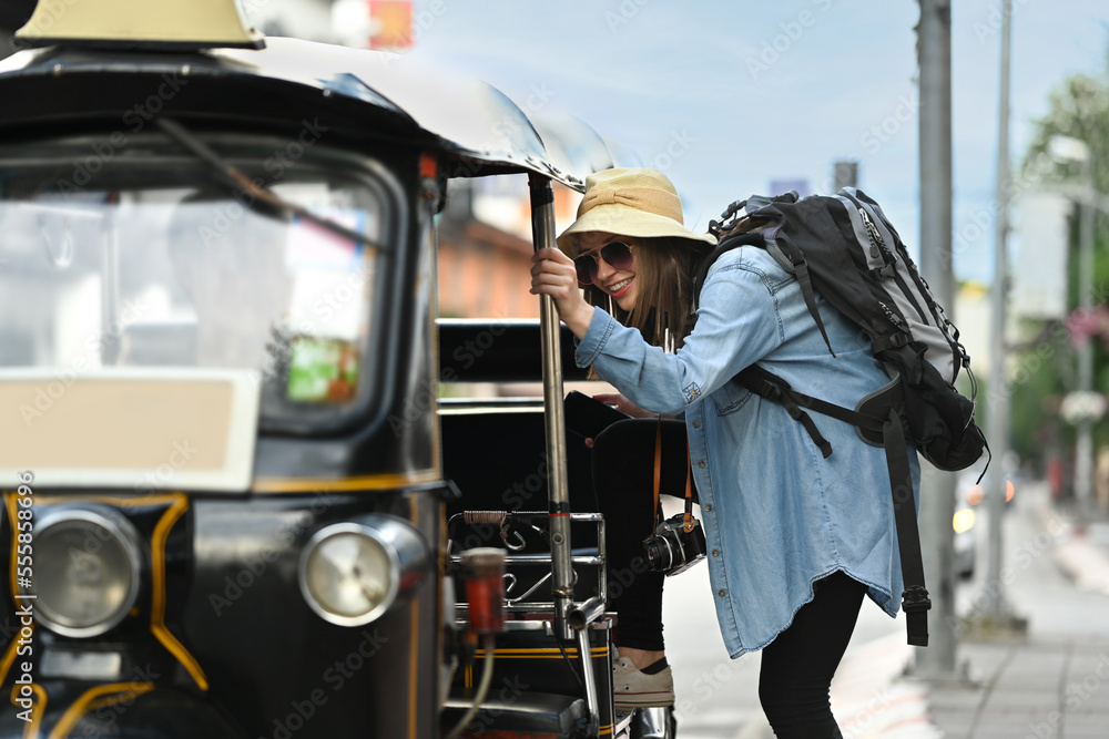 Happy caucasian female traveler with backpack on holiday vacation trip in Thailand. Blogger, vacation and journey concept