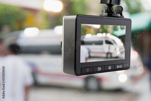 Car CCTV camera video recorder with ambulance car on the road