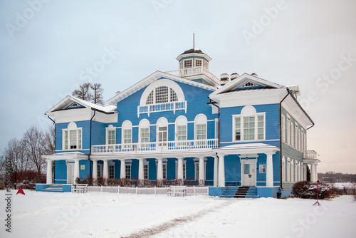 An old beautiful mansion with a wooden veranda, built in the 19th century. A big old house with a garden in Cherepovets, Russia. The building houses a museum 