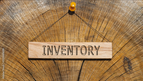 The word Inventroy. Background log written on wooden board