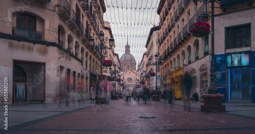Zaragoza Alfonso I main street  Timelapse on a cloudy winter morning spain city people shopping and tourist view of basilica del Pilar photo