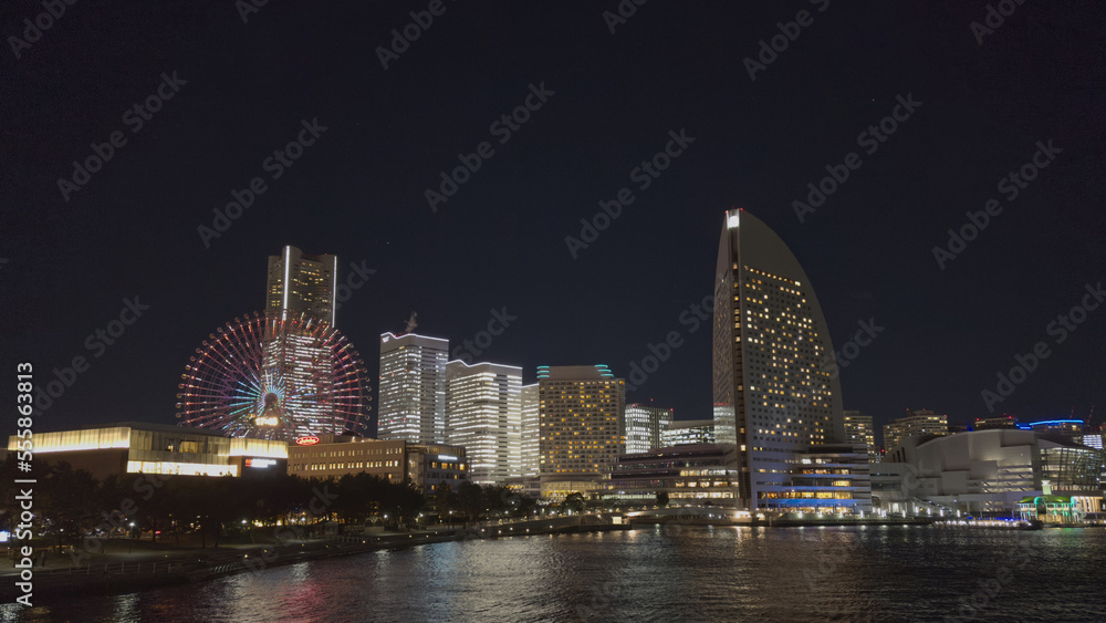 Night view of the city of Yokohama, in the background the Ferris wheel