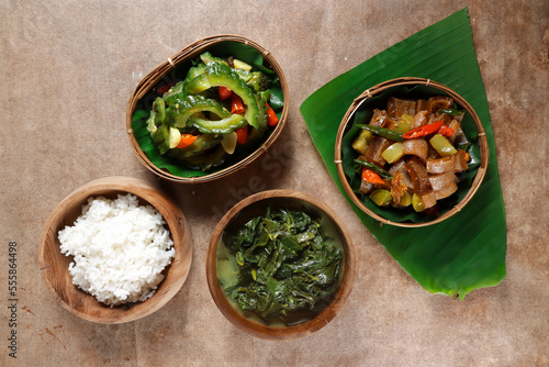 Hidangan Tradisional Jawa is Traditional javanese dish, consist of sayur bobor, oseng kikil, oseng pare dan nasi. photo