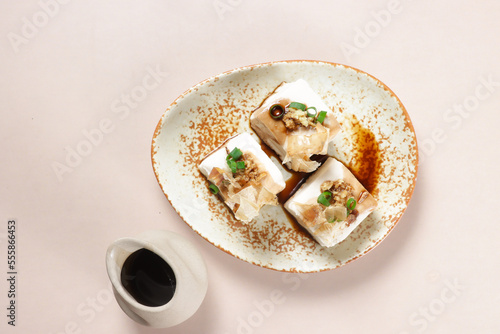 Hiyayakko is Japanese Food made from Chilled Tofu with topping like grated ginger, shallots, bonito flakes and soy sauce.