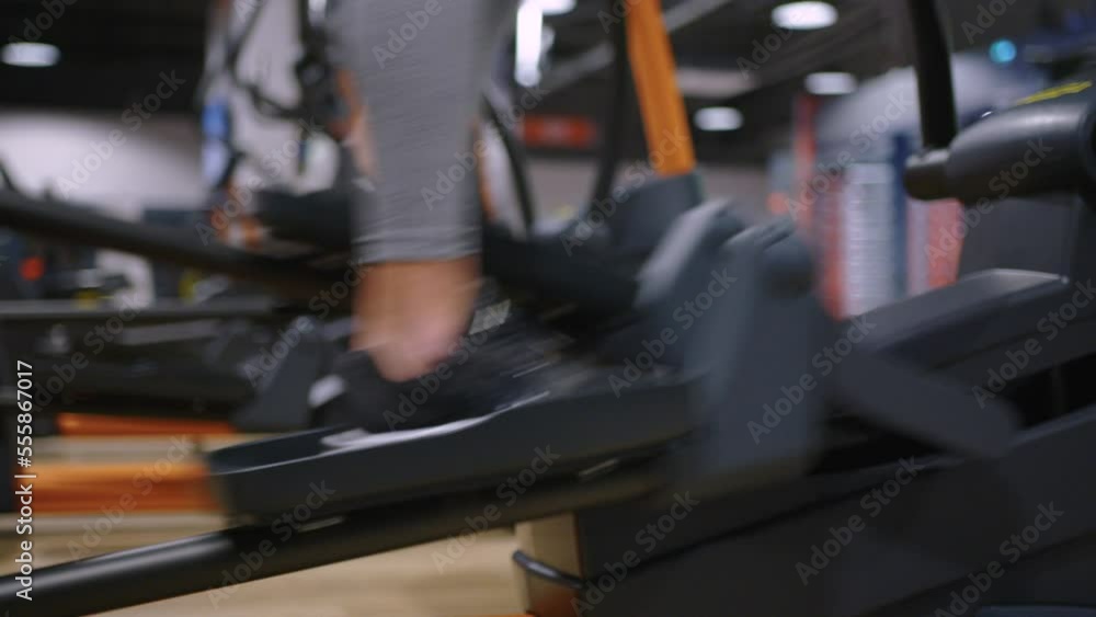 A modern, advanced woman performs sports exercises in the gym to maintain a beautiful body shape and health. Sports training and healthy lifestyle. Sport lifestyle concept A modern, advanced woman performs sports exercises in the gym to maintain a beautiful body shape and health. Sports training and healthy lifestyle. Sport lifestyle concept