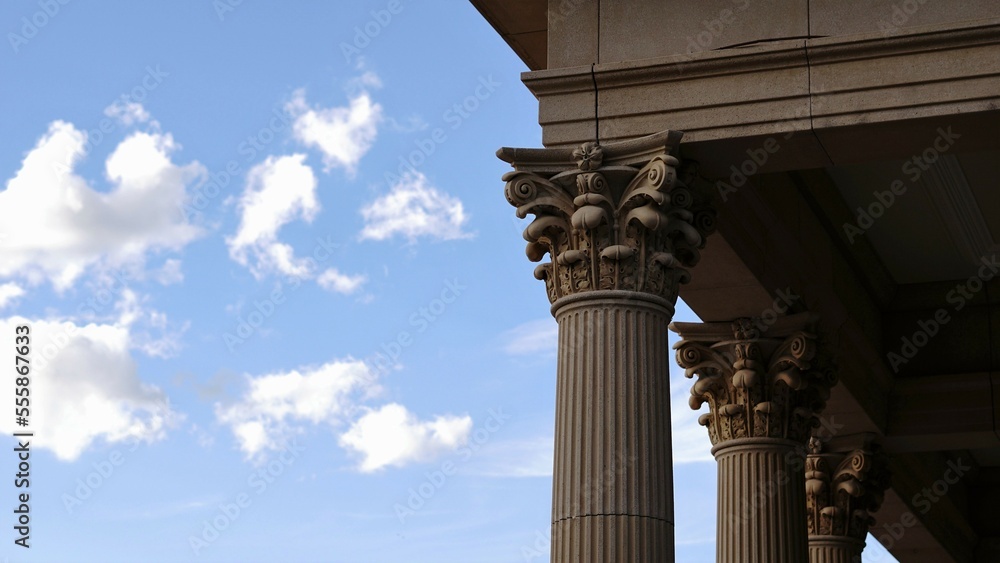 Corinthian columns against cloudy sky Corinthian columns against cloudy sky
