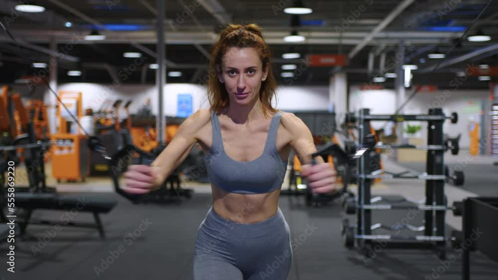 A modern, advanced woman performs sports exercises in the gym to maintain a beautiful body shape and health. Sports training and healthy lifestyle. Sport lifestyle concept A modern, advanced woman performs sports exercises in the gym to maintain a beautiful body shape and health. Sports training and healthy lifestyle. Sport lifestyle concept