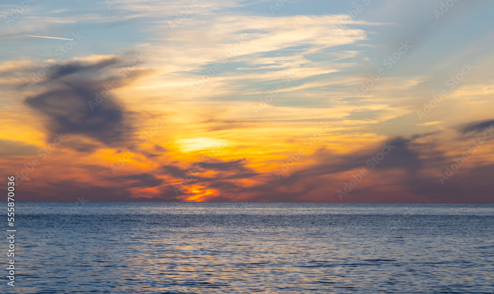 dramatic clouds during sunset over the sea