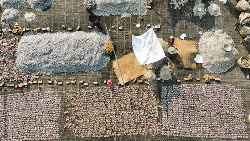 Brahmanbaria, Bangladesh - 14 December 2022: Aerial view of people drying fish in a market in Ashuganj. photo