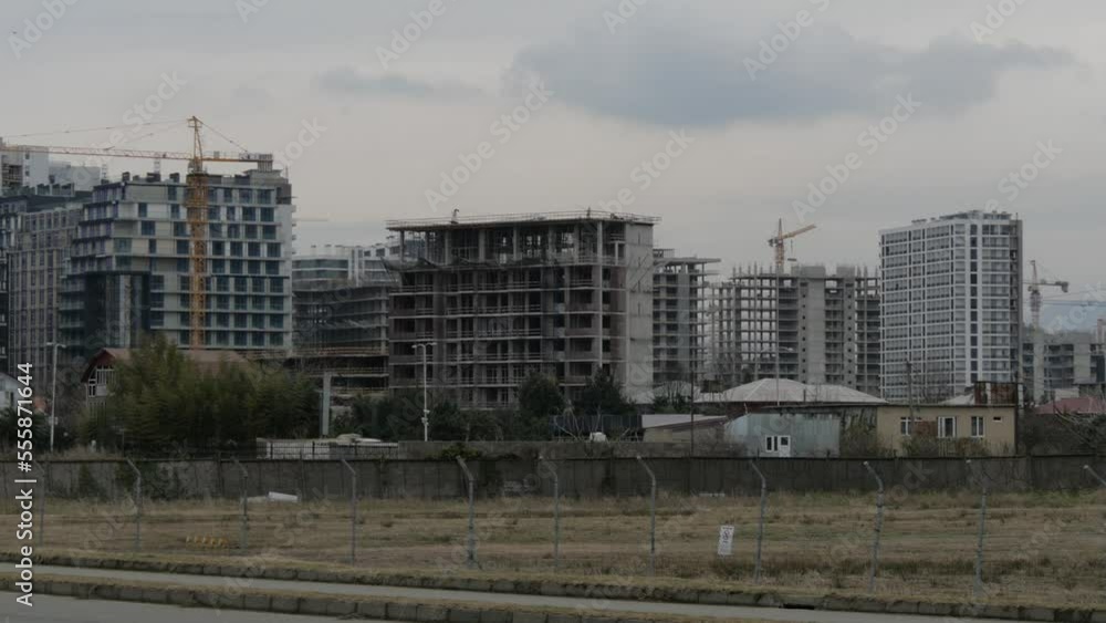 Workers work at a construction site. Working day at the construction site. Building construction. Skyscraper construction. Construction in Batumi. Workers work at a construction site. Working day at the construction site. Building construction. Skyscraper construction. Construction in Batumi.