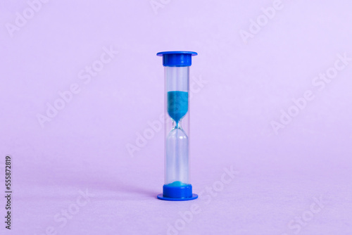 hourglass on the table, sand clock as time passing concept for business deadline, copy space