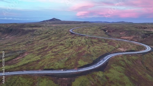 Aerial View Of Cars Driving Through Route 1 During Sunrise With Pink Skies In Iceland.  photo