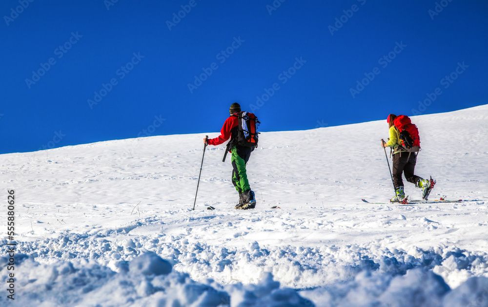 Cross-country skiing on snowy hillside. Winter season sport activities