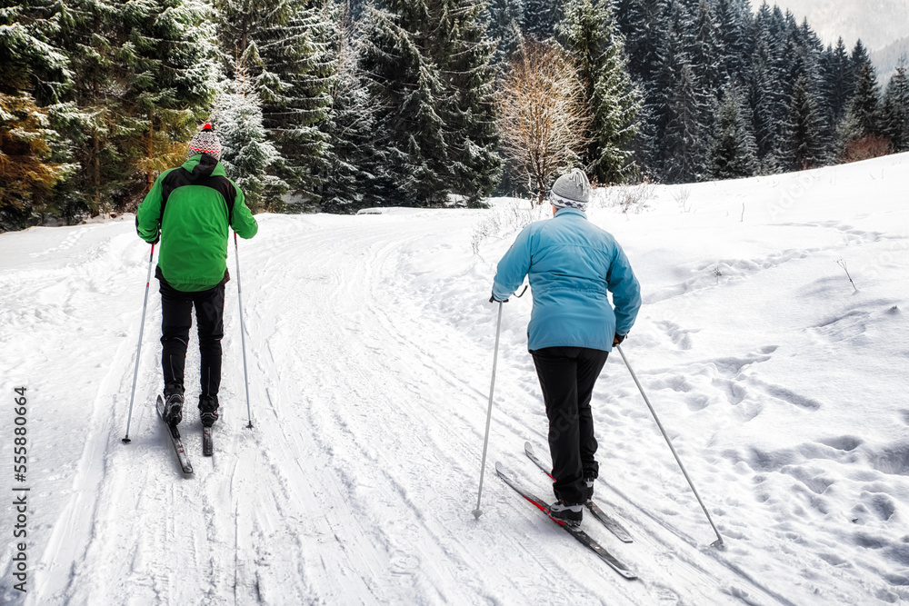 Active seniors. Cross-country skiing. Winter sport activities