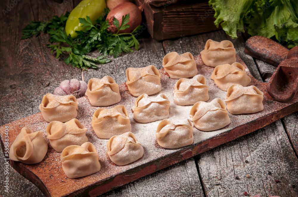 Stuffed dumplings, manti of dough and minced, close up Stuffed dumplings, manti of dough and minced, close up